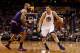 PHOENIX, AZ - FEBRUARY 10: Andrew Bogut #12 of the Golden State Warriors handles the ball under pressure from Tyson Chandler #4 of the Phoenix Suns during the NBA game at Talking Stick Resort Arena on February 10, 2016 in Phoenix, Arizona. The Warriors defeated the Suns 112-104. NOTE TO USER: User expressly acknowledges and agrees that, by downloading and or using this photograph, User is consenting to the terms and conditions of the Getty Images License Agreement. (Photo by Christian Petersen/Getty Images)