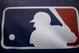 Rain drops cover the Major League Baseball logo before the start of Game 3 of the American League baseball championship series between the Baltimore Orioles and the Kansas City Royals Monday, Oct. 13, 2014, in Kansas City, Mo. The Royals lead the series 2-0. (AP Photo/Matt Slocum )