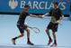 Bob Bryan, left, and his brother and playing partner Mike Bryan of the United States touch hands as they play against Jamie Murray of Britain and John Peers of the United States during their men's double tennis match at the ATP World Tour Finals at the O2 Arena in London, Thursday, Nov. 19, 2015. (AP Photo/Alastair Grant)