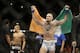 Connor McGregor celebrates after defeating Dustin Poirier in their featherweight mixed martial arts bout at UFC 178 on Saturday, Sept. 27, 2014, in Las Vegas. (AP Photo/John Locher)
