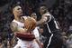Brooklyn Nets forward Thaddeus Young (30) fouls Portland Trail Blazers guard Damian Lillard as he drives to the basket during the fourth quarter of an NBA basketball game in Portland, Ore., Tuesday, Feb. 23, 2016. The Blazers won 112-104. (AP Photo/Steve Dykes)