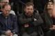 Madison Square Garden Chairman James Dolan, center, reacts during the first half of an NBA basketball game between the New York Knicks and the Charlotte Hornets, Saturday, Jan. 10, 2015, in New York. (AP Photo/Frank Franklin II)