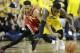 Wisconsin guard Jordan Hill, left, fights for a loose ball with Iowa guard Anthony Clemmons during the first half of an NCAA college basketball game, Wednesday, Feb. 24, 2016, in Iowa City, Iowa. (AP Photo/Charlie Neibergall)