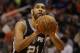 San Antonio Spurs center Tim Duncan (21) in the third quarter during an NBA basketball game against the Phoenix Suns, Sunday, Feb. 21, 2016, in Phoenix. The Spurs defeated the Suns 118-111. (AP Photo/Rick Scuteri)