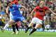 Chelsea's Portuguese midfielder Deco (L) vies with Manchester United's English midfielder Paul Scholes (R) during the English Premier League football match between Manchester United and Chelsea at Old Trafford in Manchester, north-west England on April 3, 2010. AFP PHOTO/ANDREW YATES. FOR EDITORIAL USE Additional licence required for any commercial/promotional use or use on TV or internet (except identical online version of newspaper) of Premier League/Football League photos. Tel DataCo +44 207 2981656. Do not alter/modify photo (Photo credit should read ANDREW YATES/AFP/Getty Images)