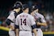 Houston Astros starting pitcher Lance McCullers, right, wipes the sweat from his face as he talks with manager A.J. Hinch (14) and catcher Jason Castro during a mound visit in the fourth inning of a baseball game against the Arizona Diamondbacks, Sunday, Oct. 4, 2015, in Phoenix. The Diamondbacks defeated the Astros 5-3. (AP Photo/Ralph Freso)