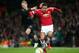 MANCHESTER, ENGLAND - FEBRUARY 25: Memphis Depay of Manchester United and Andre Romer of FC Midtjylland compete for the ball during the UEFA Europa League Round of 32 second leg match between Manchester United and FC Midtjylland at Old Trafford on February 25, 2016 in Manchester, United Kingdom. (Photo by Alex Livesey/Getty Images)