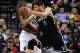 Brooklyn Nets center Brook Lopez (11) drives to the basket on Portland Trail Blazers center Ed Davis during the fourth quarter of an NBA basketball game in Portland, Ore., Tuesday, Feb. 23, 2016. The Blazers won 112-104. (AP Photo/Steve Dykes)