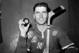 New York Rangers forward Andy Bathgate poses in the locker room at New York's Madison Square Garden, on November 12, 1961. He is holding the puck that accounted for the 200th goal of his career, which he scored against the Chicago Black Hawks. (AP Photo)