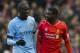 Liverpool's Kolo Toure, right, walks from the pitch with his younger brother Manchester City's Yaya Toure after the English Premier League soccer match between Liverpool and Manchester City at Anfield Stadium, Liverpool, England, Sunday, March 1, 2015. Liverpool won the match 2-1. (AP Photo/Jon Super)