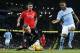 Manchester City's Raheem Sterling, right , looks down and Liverpool’s goalkeeper Simon Mignolet gathers the ball during the English Premier League soccer match between Manchester City and Liverpool at the Etihad Stadium, Manchester, England, Saturday, Nov. 21, 2015. (AP Photo/Jon Super)