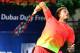 Stanislas Wawrinka of Switzerland serves to Marcos Baghdatis of Cyprus during their ATP final tennis match of the Dubai Duty Free Tennis Championships on February 27, 2016. / AFP / MARWAN NAAMANI (Photo credit should read MARWAN NAAMANI/AFP/Getty Images)