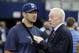 Dallas Cowboys owner Jerry Jones, right, talks with injured quarterback Tony Romo, left, before an NFL football game against the New England Patriots, Sunday, Oct. 11, 2015, in Arlington, Texas. (AP Photo/Brandon Wade)