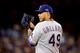 TORONTO, ON - OCTOBER 08: Yovani Gallardo #49 of the Texas Rangers looks to throw a pitch against the Toronto Blue Jays during game one of the American League Division Series at Rogers Centre on October 8, 2015 in Toronto, Ontario, Canada. (Photo by Tom Szczerbowski/Getty Images)
