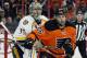 Nashville Predators' Pekka Rinne, left, looks past Philadelphia Flyers' Colin McDonald as they watch the play during the second period of an NHL hockey game Friday, Nov. 27, 2015 in Philadelphia. The Flyers won 3-2 in overtime. (AP Photo/Tom Mihalek)