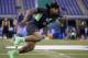 Mississippi defensive lineman Robert Nkemdiche runs a drill at the NFL football scouting combine on Sunday, Feb. 28, 2016, in Indianapolis. (AP Photo/Darron Cummings)