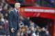 Arsenal's manager Arsene Wenger waits for the start of the English Premier League soccer match between Manchester United and Arsenal at Old Trafford Stadium, Manchester, England, Sunday, Feb. 28, 2016. (AP Photo/Jon Super)