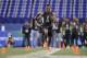 Ohio State defensive back Eli Apple runs a drill at the NFL football scouting combine on Monday, Feb. 29, 2016, in Indianapolis. (AP Photo/Darron Cummings)