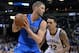 Dallas Mavericks forward Chandler Parsons, left, controls the ball against Memphis Grizzlies forward Matt Barnes (22) in the second half of an NBA basketball game Saturday, Feb. 6, 2016, in Memphis, Tenn. (AP Photo/Brandon Dill)