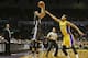Golden State Warriors guard Stephen Curry makes a three point shot over the defense of Los Angeles Lakers guard Jordan Clarkson in the first half of an NBA preseason basketball game Saturday, Oct. 17, 2015, in San Diego. (AP Photo/Lenny Ignelzi)