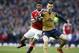 Manchester United's Marcus Rashford, left vies for the ball with Arsenal's Laurent Koscielny during the English Premier League soccer match between Manchester United and Arsenal at Old Trafford Stadium, Manchester, England, Sunday, Feb. 28, 2016. (AP Photo/Jon Super)