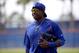 New York Mets' Yoenis Cespedes walks onto a field during spring training baseball practice Friday, Feb. 26, 2016, in Port St. Lucie, Fla. (AP Photo/Jeff Roberson)