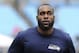 Seattle Seahawks strong safety Kam Chancellor warms up before the first half of an NFL divisional playoff football game between the Carolina Panthers and the Seattle Seahawks, Sunday, Jan. 17, 2016, in Charlotte, N.C. (AP Photo/Mike McCarn)