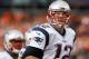 New England Patriots quarterback Tom Brady looks at the scoreboard as he runs off the field during the first half of the NFL football AFC Championship game between the Denver Broncos and the New England Patriots, Sunday, Jan. 24, 2016, in Denver. (AP Photo/Joe Mahoney)