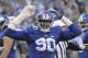 FILE - In this Dec. 6, 2015, file photo, New York Giants defensive end Jason Pierre-Paul reacts during the Giants' NFL football game against the New York Jets in East Rutherford, N.J. Pierre-Paul has filed a lawsuit seeking in more than $15,000 in damages against ESPN and reporter Adam Schefter for posting his medical records. The lawsuit, filed Wednesday, Feb. 24, 2016, in Miami Dade County in Florida, alleges that Pierre-Paul's privacy was violated–as was Florida's medical records statute–by the report last summer after the player severely injured his right hand in a fireworks accident on July 4. (AP Photo/Bill Kostroun)
