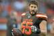 FILE - In this Jan. 3, 2016, file photo, Cleveland Browns center Alex Mack stands on the sideline during an NFL football game against the Pittsburgh Steelers , in Cleveland. A person familiar with the decision says Browns Pro Bowl center Alex Mack is voiding the final three years of his contract and will become a free agent. Mack was set to make $24 million over the next three years, but chose to opt out of the deal, said the person who spoke Wednesday, March 2, 2016, to The Associated Press on condition of anonymity because of the sensitivity of the talks. (AP Photo/David Richard, File)