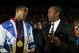 Former heavyweight champion Lennox Lewis (seen here with Anthony Joshua) thinks allowing pros to compete at the Olympics is dangerous.