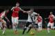 Tottenham’s Harry Kane, right, makes a late break from Arsenal’s Per Mertesacker, second left, and Laurent Koscielny during the English Premier League soccer match between Arsenal and Tottenham Hotspur at the Emirates Stadium in London, Sunday Nov. 8, 2015. (AP Photo/Tim Ireland)