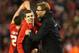 LIVERPOOL, ENGLAND - JANUARY 26: Jurgen Klopp manager of Liverpool and Jon Flanagan of Liverpool celebrate victory in the penalty shoot out after the Capital One Cup semi final second leg match between Liverpool and Stoke City at Anfield on January 26, 2016 in Liverpool, England. Liverpool win 6-5 on penalties after extra time. (Photo by Clive Brunskill/Getty Images)