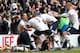 Tottenham Hotspur's English striker Harry Kane (C) celebrates with teammates after scoring their second goal during the English Premier League football match between Tottenham Hotspur and Arsenal at White Hart Lane in London, on March 5, 2016. / AFP / IKIMAGES / IKimages / RESTRICTED TO EDITORIAL USE. No use with unauthorized audio, video, data, fixture lists, club/league logos or 'live' services. Online in-match use limited to 45 images, no video emulation. No use in betting, games or single club/league/player publications. (Photo credit should read IKIMAGES/AFP/Getty Images)