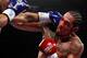 NEW YORK, NY - DECEMBER 03: Miguel Cotto of Puerto Rico connects with a punch to the right eye of Antonio Margarito of Mexico during the WBA World Junior Middleweight Title fight at Madison Square Garden on December 3, 2011 in New York City. (Photo by Al Bello/Getty Images)