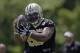 New Orleans Saints guard Senio Kelemete (65) pulls in a pass during mini camp at their NFL football training facility in Metairie, La., Thursday, June 18, 2015. (AP Photo/Gerald Herbert)