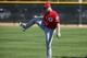 Cincinnati Reds' Zack Cozart stretches out during a spring training baseball workout Thursday, Feb. 25, 2016, in Goodyear, Ariz. (AP Photo/Ross D. Franklin)