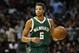 Milwaukee Bucks guard Michael Carter-Williams (5) dribbles against the Atlanta Hawks in the second half of an NBA basketball game, Saturday, Feb. 20, 2016, in Atlanta. Milwaukee won 117-109 in double overtime. (AP Photo/Brett Davis)