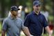 Tiger Woods, left, and Indianapolis Colts quarterback Peyton manning, right, talk as they walk down the third fairway during the pro-am of the Quail Hollow Championship golf tournament at the Quail Hollow Club in Charlotte, N.C., Wednesday, April 29, 2009. (AP Photo/Chuck Burton)