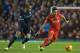 Liverpool's Roberto Firmino, rigth, fights for the ball against Manchester City's Fernando during the English Premier League soccer match between Liverpool and Manchester City at Anfield Stadium, Liverpool, England, Wednesday, March 2, 2016. (AP Photo/Jon Super)