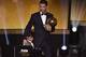 Real Madrid and Portugal forward Cristiano Ronaldo (R) stands on stage with his son Cristiano Jr after receiving the 2014 FIFA Ballon d'Or award ceremony at the Kongresshaus in Zurich on January 12, 2015. AFP PHOTO / FABRICE COFFRINI (Photo credit should read FABRICE COFFRINI/AFP/Getty Images)