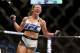 Miesha Tate celebrates victory over Holly Holm in their UFC 196 women’s bantamweight mixed martial arts match Saturday, March 5, 2016, in Las Vegas. (AP Photo/Eric Jamison)