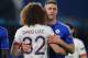 Chelsea's English defender Gary Cahill (R) embraces Paris Saint-Germain's Brazilian defender David Luiz (L) at the end of the UEFA Champions League round of 16 second leg football match between Chelsea and Paris Saint-Germain (PSG) at Stamford Bridge in London on March 9, 2016. / AFP / GLYN KIRK (Photo credit should read GLYN KIRK/AFP/Getty Images)
