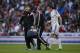 Real Madrid's Gareth Bale, right, leaves the field after he got injured during a Spanish La Liga soccer match between Real Madrid and Malaga at the Santiago Bernabeu stadium in Madrid, Spain, Saturday, April 18, 2015. (AP Photo/Andres Kudacki)