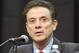 Louisville head basketball coach Rick Pitino listens to a question during a press conference, Friday, Feb. 5, 2016, in Louisville Ky. The University announced a one-year postseason ban for its men's basketball team amid ongoing investigations into a sex scandal in which an escort alleged that a former staffer paid her and other dancers to strip and have sex with recruits and players. (AP Photo/Timothy D. Easley)