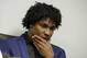Former New York Mets pitcher Jenrry Mejia, right, listens to questions during a news conference at the office of his attorney in the Queens borough of New York, Friday, March 11, 2016. Suspended for life by Major League Baseball following his third positive drug test, Mejia spoke about his next step. (AP Photo/Richard Drew)