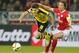 Mainz's Julian Baumgartlinger, right, and Dortmund's Julian Weigl challenge for the ball during a German Bundesliga soccer match between FSV Mainz 05 and Borussia Dortmund in Mainz, Germany, Friday, Oct. 16, 2015. (AP Photo/Michael Probst)