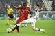 Juventus' Swiss defender Stephan Lichtsteiner (R) challenges Bayern Munich's Brazilian midfielder Douglas Costa during the UEFA Champions League round of 16 first leg football match between Juventus and Bayern Munich at the Juventus Stadium in Turin on February 23, 2016. AFP PHOTO / OLIVIER MORIN / AFP / OLIVIER MORIN (Photo credit should read OLIVIER MORIN/AFP/Getty Images)