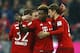 Bayern's Thomas Mueller, right, celebrates with teammates Joshua Kimmich, left, Franck Ribery, background, and David Alaba after scoring his side's third goal during the German Bundesliga soccer match between FC Bayern Munich and SV Werder Bremen at the Allianz Arena stadium in Munich, Germany, Saturday, March 12, 2016. (AP Photo/Matthias Schrader)