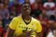 Oregon forward Chris Boucher reacts after scoring a 3-point shot against Utah during the first half of an NCAA college basketball game in the championship of the Pac-12 men's tournament Saturday, March 12, 2016, in Las Vegas. (AP Photo/John Locher)
